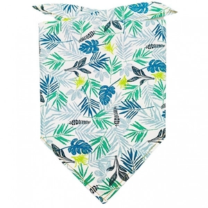 Dog bandana with tropical green palm leaf patterns on white fabric background