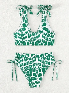 Detail of leopard print bikini set featuring V-neck top with adjustable shoulder ties