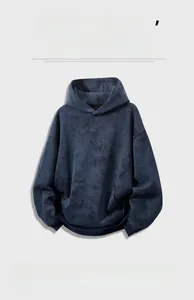 Detailed view of dark blue tie-dye hoodie featuring soft brushed texture and kangaroo pocket