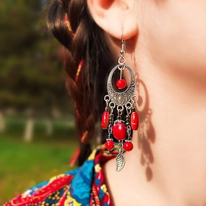 Ethnic acrylic tassel leaf earrings with red beads and silver filigree for women