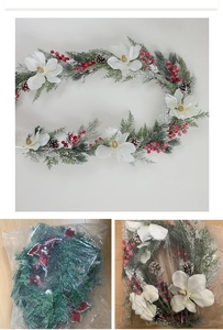 Detailed Christmas garland showing white magnolia flowers, pine cones and red berries