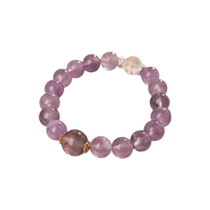 Elegant purple amethyst zircon beaded bracelet with gold accents on a white background
