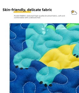 Close-up of quilted brushed fabric for dog sleeping mat with cartoon dinosaur pattern