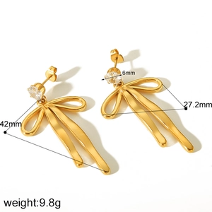 Detail view of 18k gold plated bow earrings with white zircon and exact dimensions