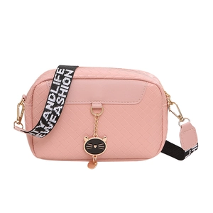 Pink shell crossbody bag with woven texture and a cute cat pendant with wide strap