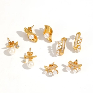 Elegant gold-plated stainless steel earrings set with pearls and zircons on white background