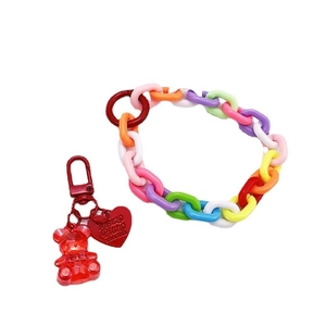 Colorful plastic link wrist lanyard with a red transparent bear charm and heart tag