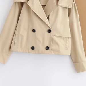 Short khaki double-breasted trench coat with wide lapels in a premium cotton blend