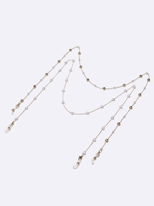 Golden eyewear chain with white heart beads and lobster clasps on white background