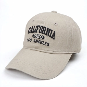 Detailed close-up of California vintage 3D embroidery on beige denim baseball cap