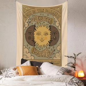 Bohemian tarot style wall tapestry with sun and moon illustrations in bedroom decor
