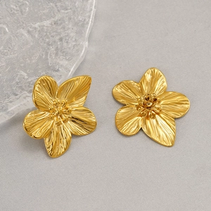 Golden flower stud earrings made of stainless steel with detailed floral texture