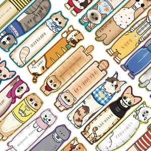 Flat lay of artistic cat bookmarks featuring Maine Coon and Persian illustrations