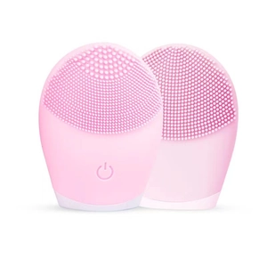 Macro detail of pink silicone facial cleanser showing soft bristles and power button
