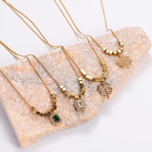 Golden stainless steel necklaces with green cat-eye stone and leaf pendants for women