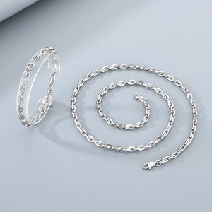 Polished silver stainless steel chain bracelet with oval links on display stand
