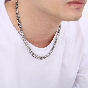 Polished silver 10mm Miami Cuban link chain necklace on male model in hip-hop style