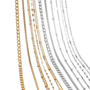 Detail of assorted vacuum gold-plated stainless steel curb, snake, and bead chains