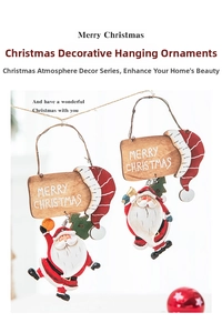 Detail of vintage Christmas resin Santa pendants with Merry Christmas wooden signs