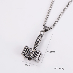 Detailed view of silver stainless steel Mjolnir pendant with Viking patterns and size labels