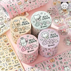 Detail of cute cartoon washi tape rolls featuring bear and rabbit art for DIY journaling