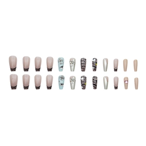 Press-on nail set with 3D star charms, silver chrome finish, and zebra pattern details