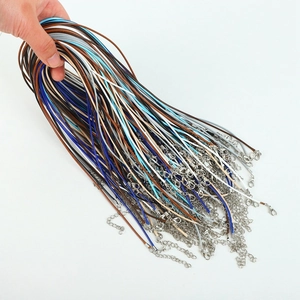 Close-up of colorful wax necklace cords with lobster clasps and extension chains