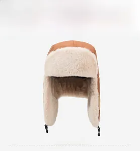 Front view of brown winter Ushanka hat with thick plush lining and ear flaps with buckle