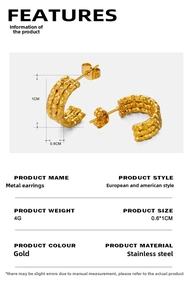 Macro detail of gold-plated stainless steel C-shaped earrings with hammered metal texture