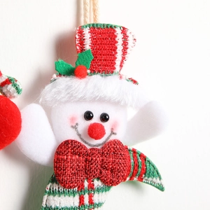 Festive snowman plush hanging ornament with red knit hat and bow for Christmas decor