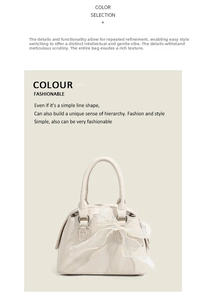 Détail d'un sac Boston blanc crème avec un nœud en tulle et une texture de cuir premium