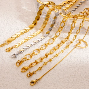 Minimalist gold and silver woven leaf chain bracelets with heart charms on white background