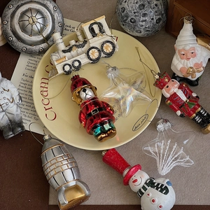 Space-themed Christmas ornaments set with retro astronaut, star and train figurines
