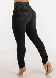 Detail view of high waist elastic jeans showing slim fit lifting and ruffled waistband