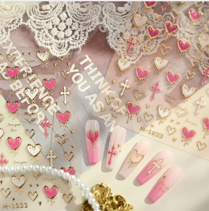 Detail view of 3D heart and cross nail stickers M-1033 with dripping gold borders