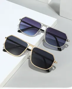Detail view of stylish oversized geometric sunglasses with metallic frames and gradient lenses