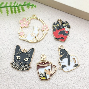 Detail view of assorted enamel cat charms for DIY jewelry making in multiple colors