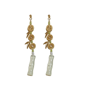 Elegant Chinese style long earrings with golden bamboo leaves and green glass charms