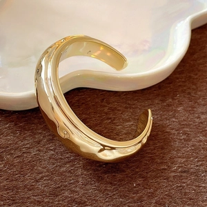 Minimalist gold-tone wavy textured open cuff bracelet with a high-polished finish for women