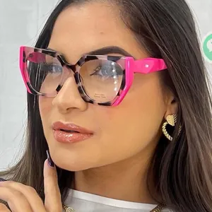 Close-up of stylish acetate square frame glasses with pink accents and tortoise pattern