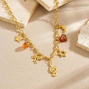 Vintage gold plated stainless steel necklace with musical note and moon charms
