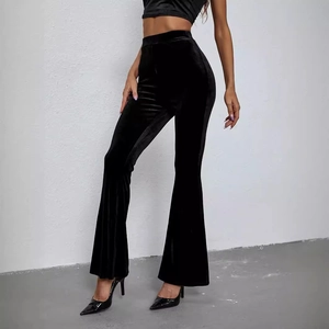 High-waist black velvet flare pants with a slim fit and elegant glossy finish