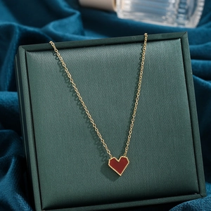 French style red heart pendant necklace in gold finish displayed on jewelry box