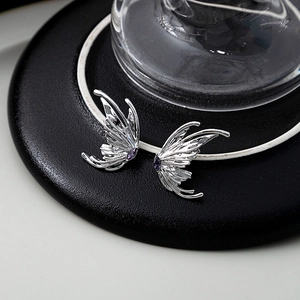 Liquid metal butterfly wing earrings with purple marquise gems and silver plating