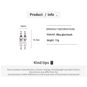 Detail view of geometric glass bead fringe earrings showing 15.7cm length and alloy material