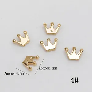 Mini gold alloy crown charms for DIY nail art and jewelry making, measuring 4.5x6mm