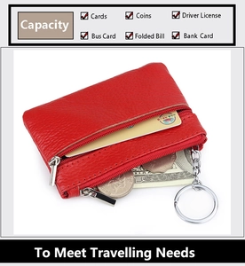 Detail view of red genuine leather coin purse with internal slots for cards and metal keychain
