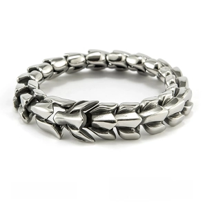 Detailed close-up of 12mm stainless steel watch strap style bracelet with scale link texture
