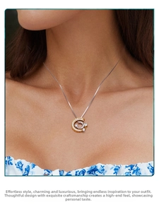 Detail of s925 sterling silver meteor necklace with micro-paved zircons on a model