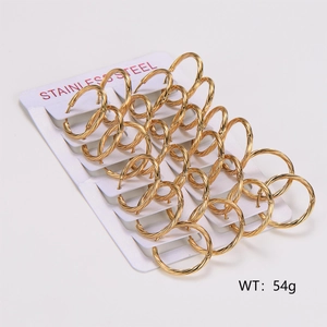 Detailed view of twelve pairs of gold twisted cable hoop earrings on a display card